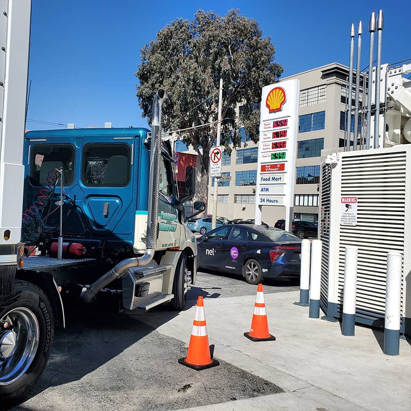 shell gas station and Thompson and Harvey truck